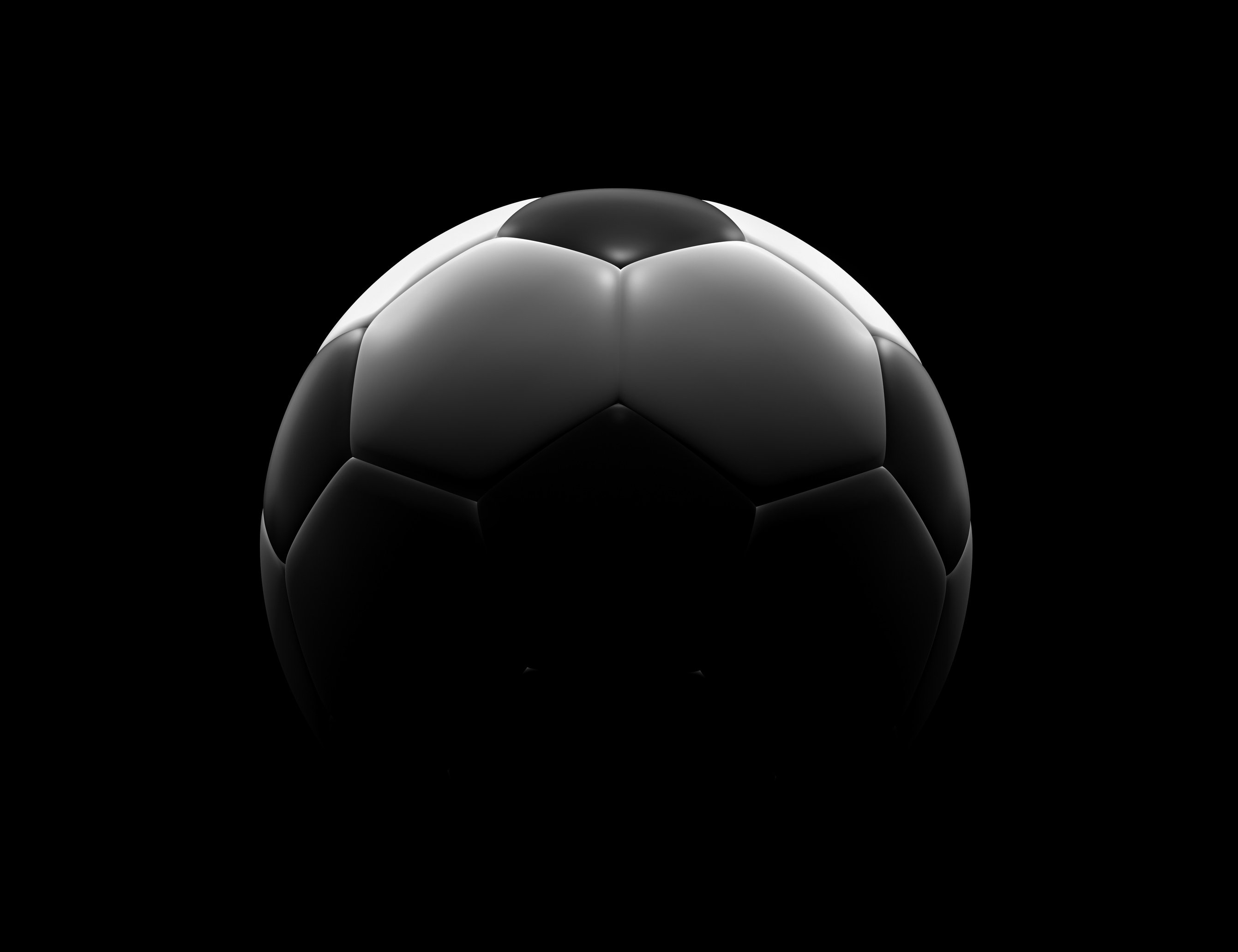 Soccer ball on black background